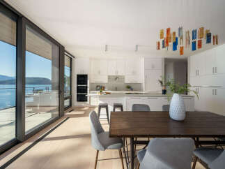 Experience luxury living in this stunning modern home with breathtaking water views.