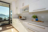 This stunning kitchen boasts modern design and breathtaking views.