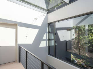 Experience modern luxury in this stunning property featuring a unique glass ceiling that floods the interior with natural light.