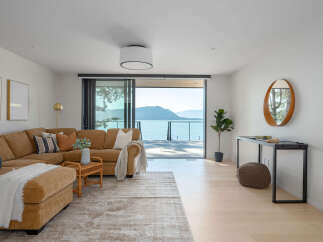 Experience luxury living with this stunning property featuring a spacious living room and breathtaking ocean views.