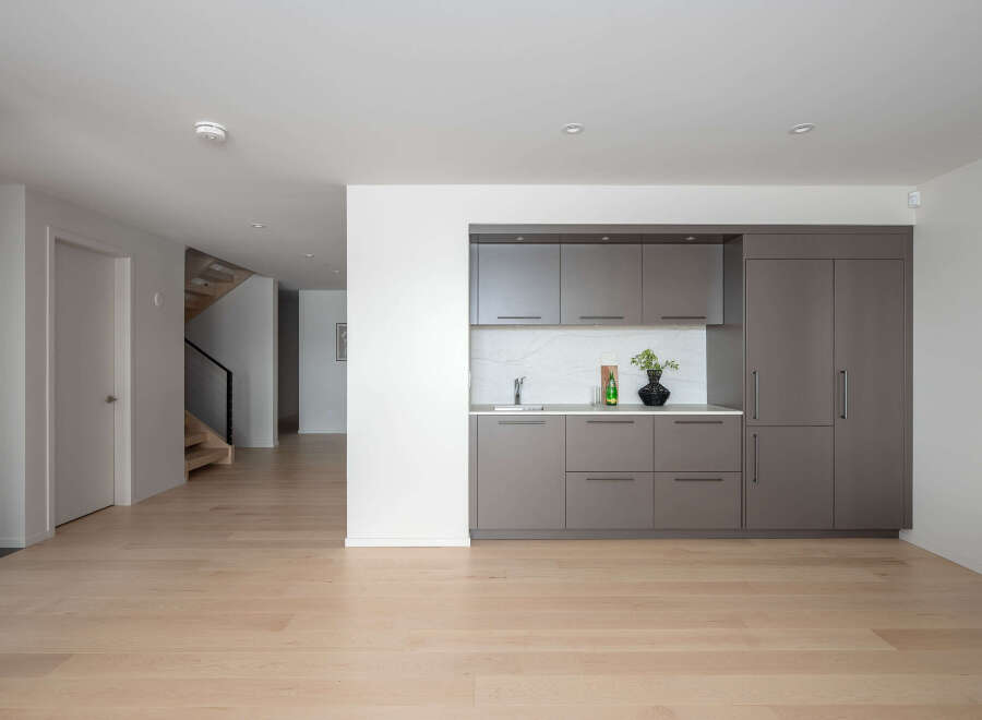 This modern home boasts a sleek, open-concept design with beautiful hardwood floors throughout.