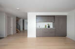 This modern home boasts a sleek, open-concept design with beautiful hardwood floors throughout.