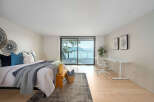 Experience luxury living in this stunning bedroom with breathtaking views.