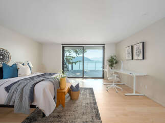 Experience luxury living in this stunning bedroom with breathtaking views.