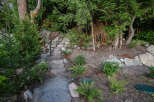 Discover the charm of this property with its inviting stone staircase leading to a hidden oasis.