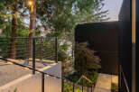 This stunning property features a modern design with a focus on natural elements.