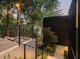 This stunning property features a modern design with a focus on natural elements.