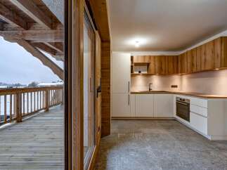 Experience the perfect blend of modern design and rustic charm in this stunning kitchen.