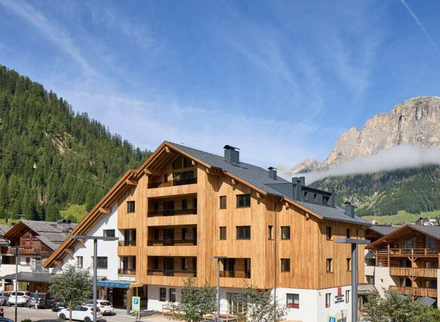 Discover the charm of this stunning property, boasting a unique wooden facade and modern design.