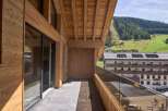 Experience the charm of this stunning property, showcasing exquisite wooden architecture and a private balcony.