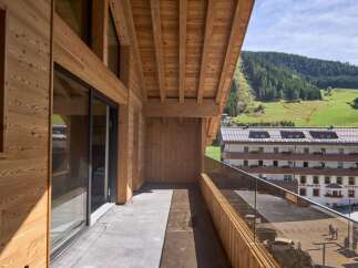Experience the charm of this stunning property, showcasing exquisite wooden architecture and a private balcony.