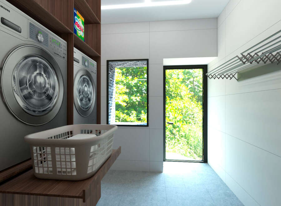 This modern laundry room features sleek Samsung washing machines and ample storage.