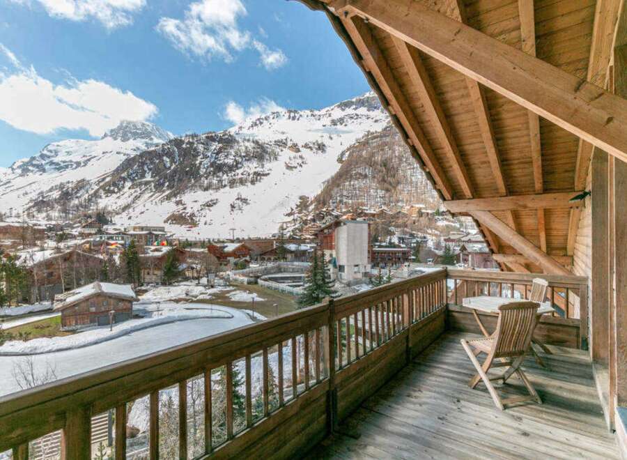 Enjoy breathtaking mountain views from this charming balcony.