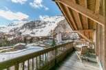 Enjoy breathtaking mountain views from this charming balcony.