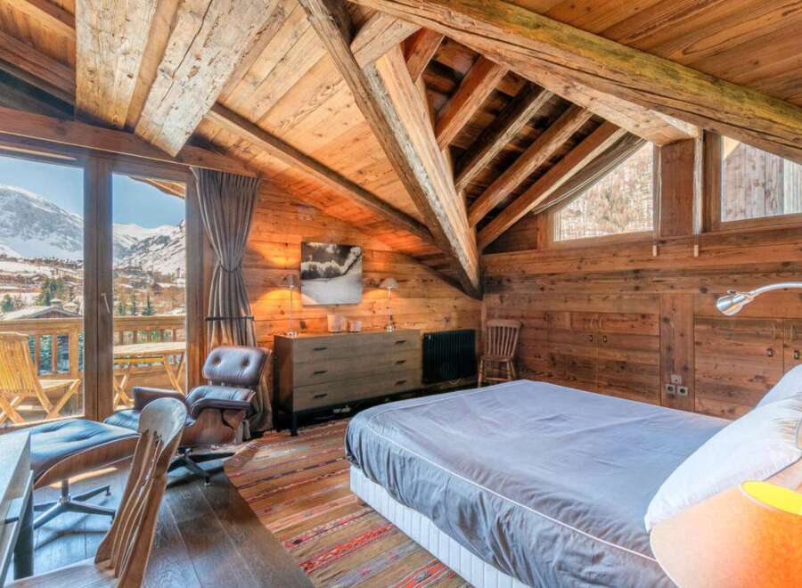 Experience the ultimate in alpine luxury with this stunning chalet bedroom.