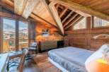 Experience the ultimate in alpine luxury with this stunning chalet bedroom.