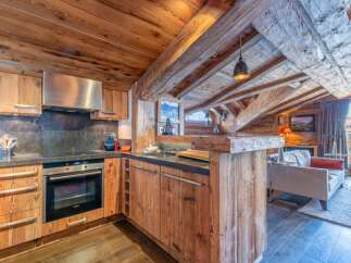 This stunning kitchen boasts a rustic, yet modern design, perfect for a cozy mountain retreat.