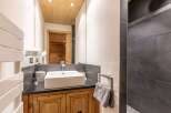 This stunning bathroom showcases a blend of rustic charm and modern elegance.