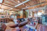 Step into rustic elegance with this stunning property, featuring a warm and inviting living space.