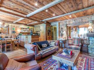Step into rustic elegance with this stunning property, featuring a warm and inviting living space.