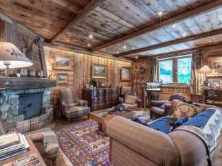 Step into rustic elegance with this stunning chalet-style living room.