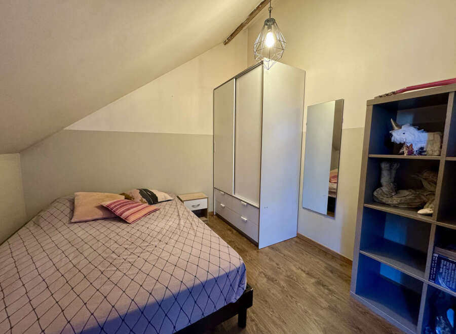 Discover the charm of this cozy bedroom, perfect for a peaceful retreat.