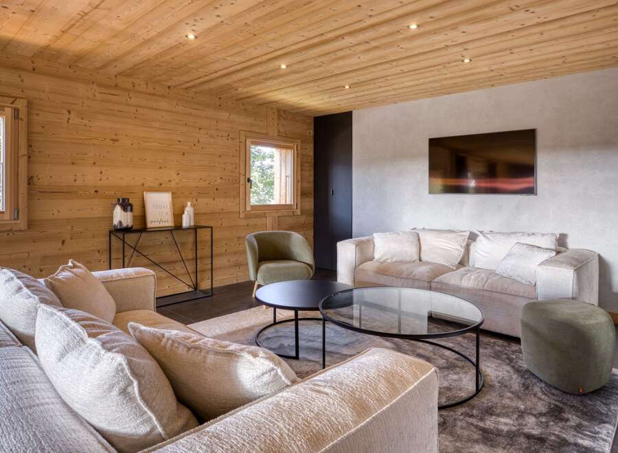 Experience the warmth and charm of this stunning living space, featuring exquisite wooden paneling throughout.