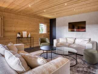 Experience the warmth and charm of this stunning living space, featuring exquisite wooden paneling throughout.