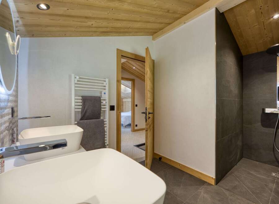 Step into luxury with this stunning bathroom, featuring a sleek design and modern amenities.