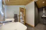 Step into luxury with this stunning bathroom, featuring a sleek design and modern amenities.