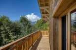 Enjoy breathtaking mountain views from this stunning wooden balcony.