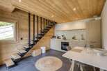 This stunning property features a modern kitchen with sleek cabinetry and stainless steel appliances.