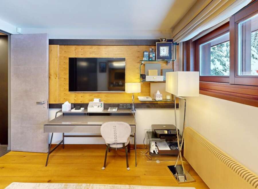 Discover the epitome of luxury living in this stunning property, featuring a meticulously designed home office space.