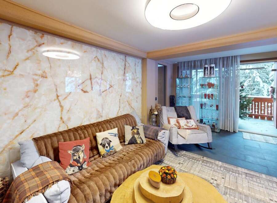 Experience luxury living in this stunning property, featuring a beautifully designed living room.