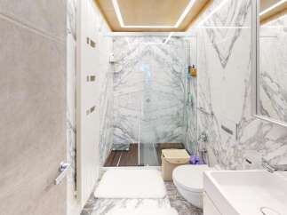Step into luxury with this stunning bathroom, featuring exquisite marble accents and a modern design.