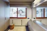 This stunning property boasts a modern bathroom with a view.