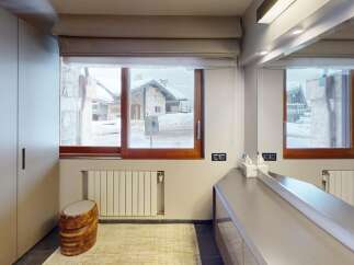 This stunning property boasts a modern bathroom with a view.