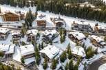 Discover a stunning mountain retreat nestled in a picturesque winter wonderland.
