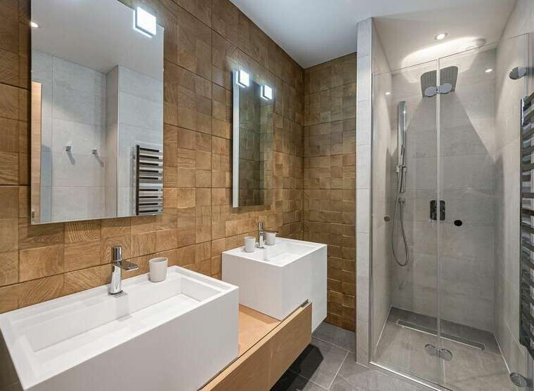 Step into luxury with this stunning bathroom featuring a modern design and high-end finishes.