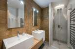Step into luxury with this stunning bathroom featuring a modern design and high-end finishes.