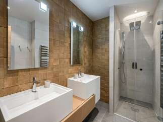Step into luxury with this stunning bathroom featuring a modern design and high-end finishes.