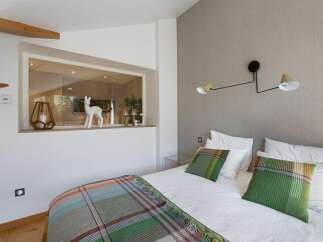 Discover a cozy bedroom retreat with a modern design.