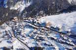 Discover the charm of this snow-covered village nestled in the mountains.