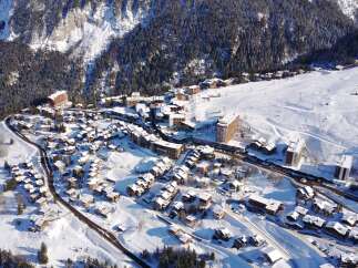 Discover the charm of this snow-covered village nestled in the mountains.