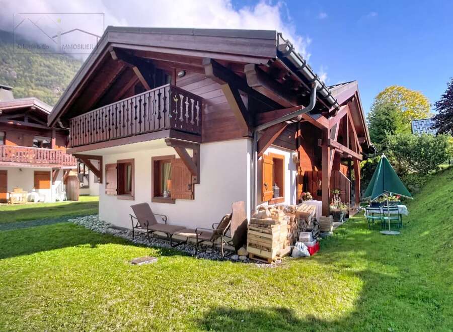 Discover the charm of this stunning chalet-style home, boasting a beautiful wooden facade and a welcoming balcony.