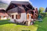 Discover the charm of this stunning chalet-style home, boasting a beautiful wooden facade and a welcoming balcony.
