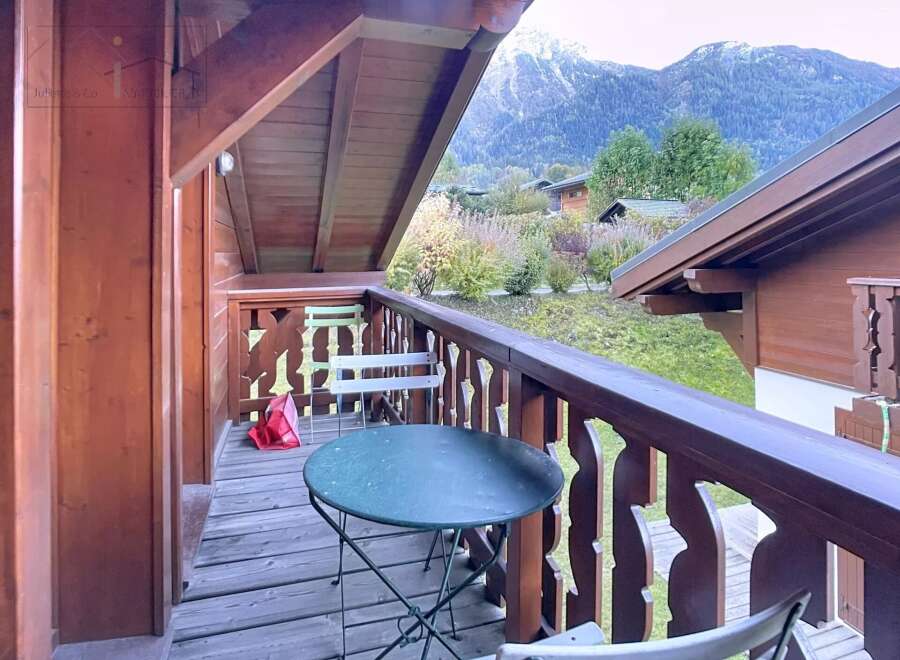 Enjoy breathtaking mountain views from this charming balcony.