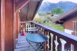 Enjoy breathtaking mountain views from this charming balcony.