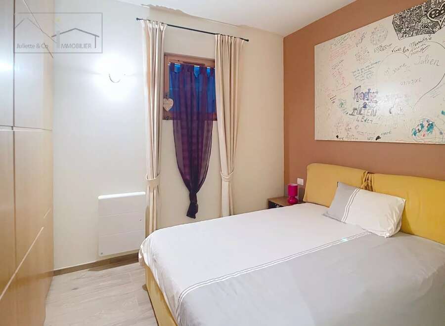 Discover a cozy bedroom retreat! This space features a comfortable bed, perfect for relaxation.