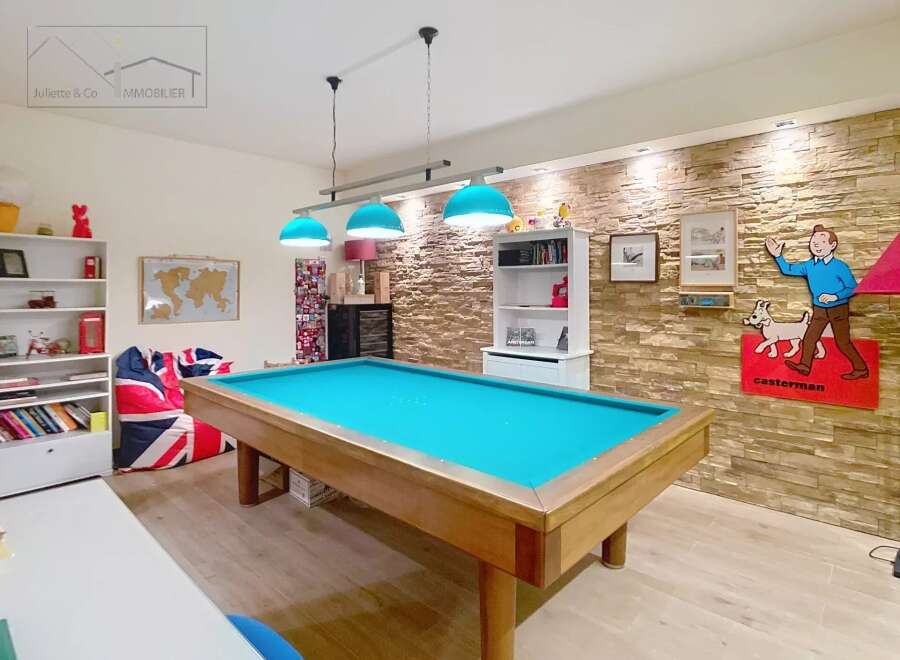 This stunning property boasts a spacious game room, perfect for entertaining and relaxation.